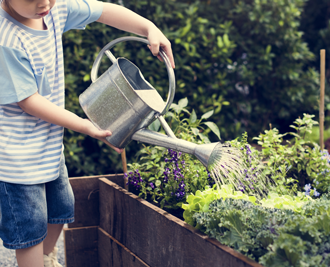 Kids watering garden