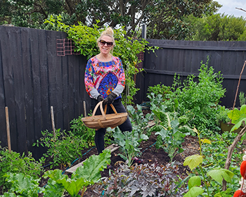 Shannon growing veges in her Papamoa patch